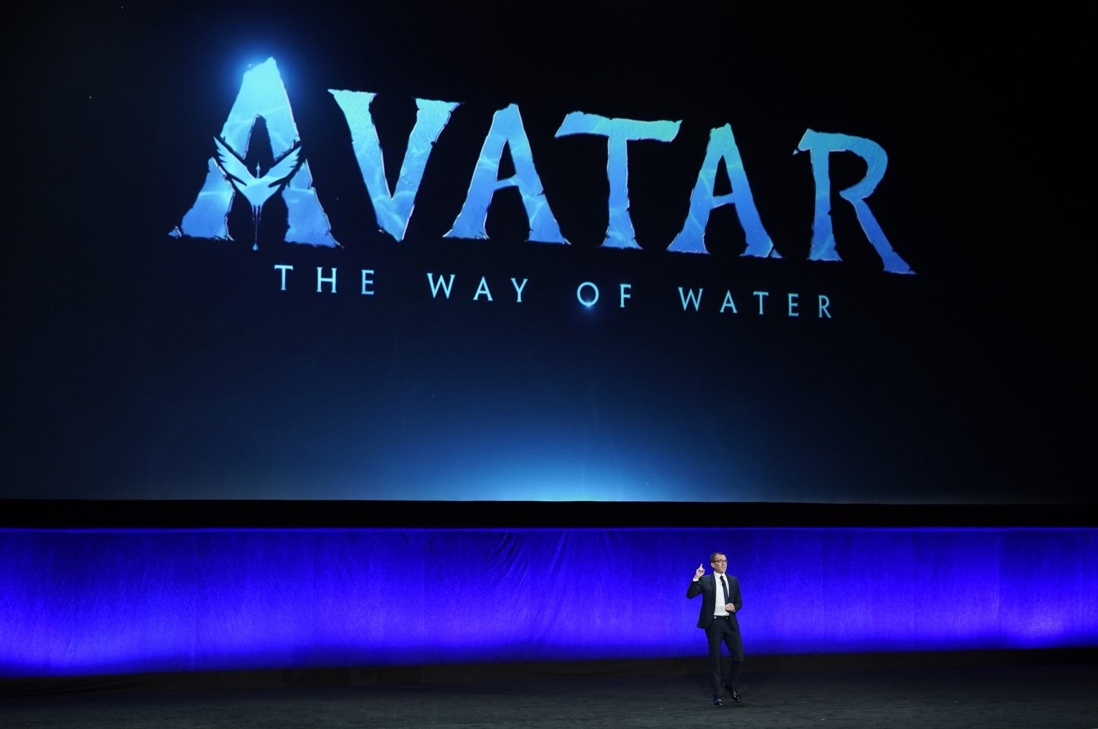 Tony Chambers, executive vice president of theatrical distribution for Walt Disney Studios, speaks underneath a graphic for the upcoming film &quot;Avatar: The Way of Water&quot; during the Walt Disney Studios presentation at CinemaCon 2022 at Caesars Palace, Las Vegas, U.S., April 27, 2022. (AP Photo)