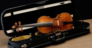 A rare 1736 violin by Italian luthier Guarneri del Gesu is displayed during a media preview at Aguttes auction house ahead of the violin's auction in Neuilly-sur-Seine, near Paris, France, April 26, 2022. (REUTERS)