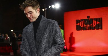 Robert Pattinson poses for photographers before the screening of &quot;The Batman&quot; in London, U.K., Feb. 23, 2022. (AP Photo)