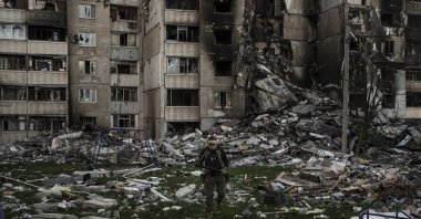A Ukrainian serviceman walks amid the rubble of a building heavily damaged by multiple Russian bombardments near a frontline in Kharkiv, Ukraine, April 25, 2022. (AP Photo)