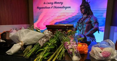 Flowers are placed at a wake for Malaysian national, who was executed for drug trafficking, during a memorial service in Singapore, April 27, 2022. (AFP Photo)