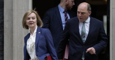 Britain's Foreign Secretary Liz Truss (L) and Britain's Defense Secretary Ben Wallace leave a Cabinet meeting at 10 Downing Street in London, April 19, 2022. (AP Photo)