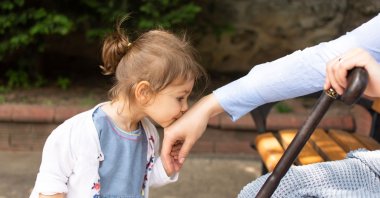 Children kissing their elders hand – and receiving some allowance – is one of the biggest traditions of Ramadan Bayram. (Shutterstock Photo)