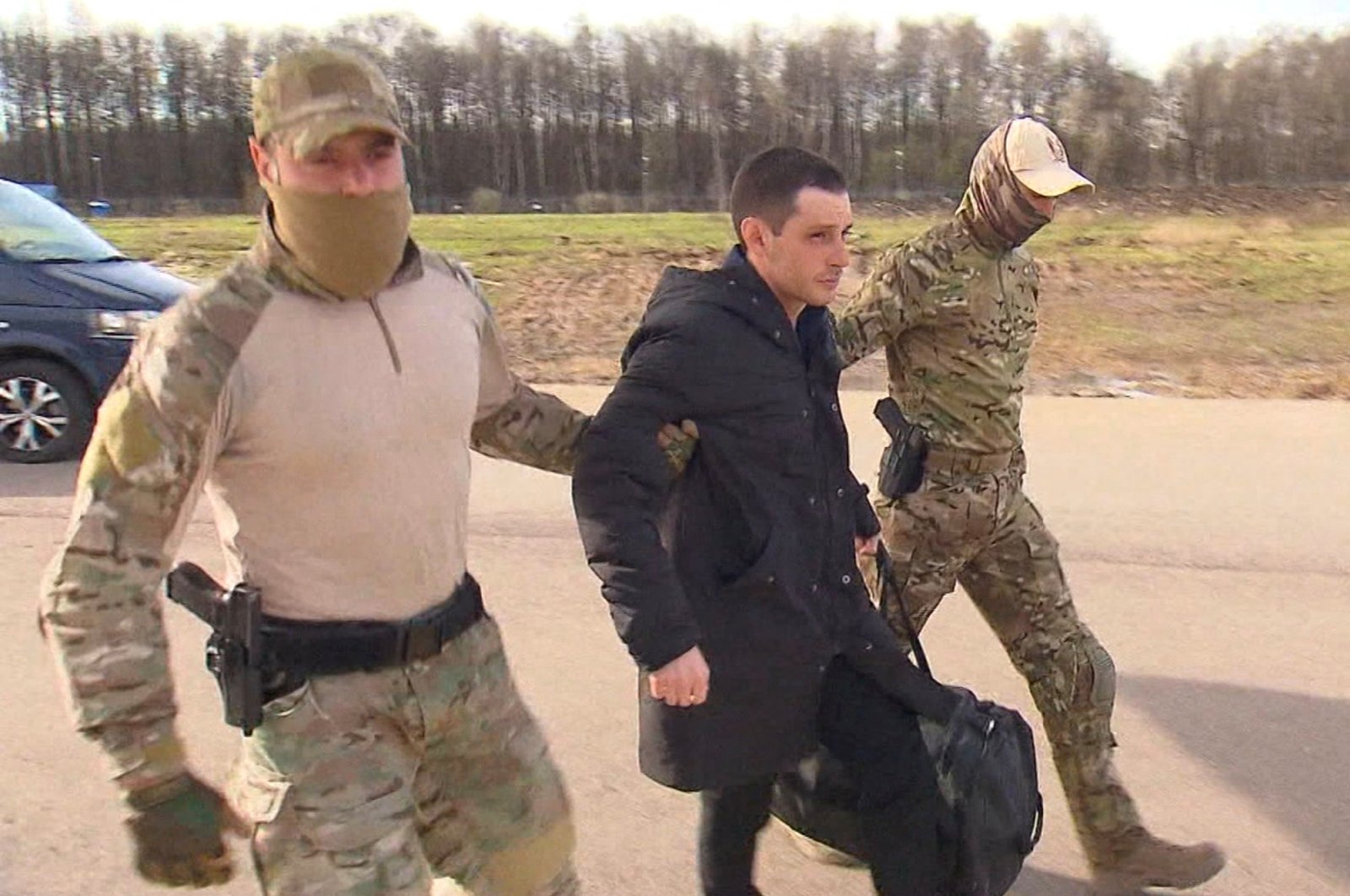 Former U.S. Marine Trevor Reed, who was detained in 2019 and accused of assaulting police officers, is escorted to a plane by Russian service members as part of a prisoner swap between the U.S. and Russia, in Moscow, Russia, April 27, 2022. (REUTERS Photo)