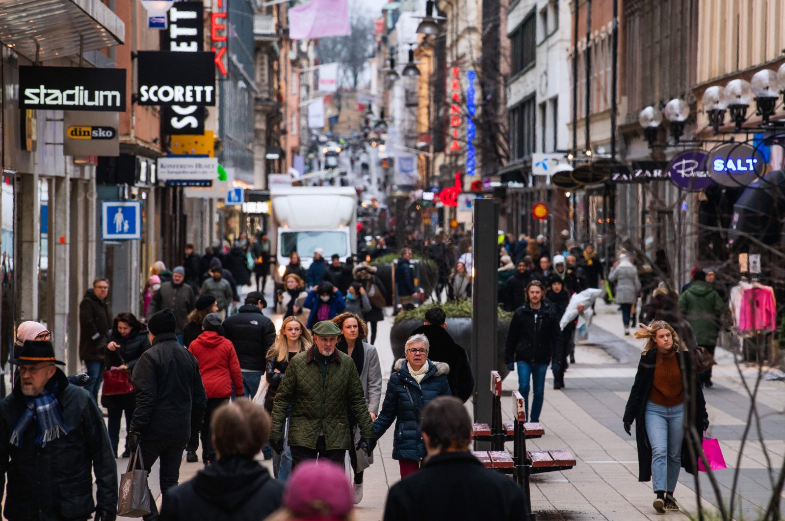 People walk in one of Stockholm&#039;s busiest shopping streets, Stockholm, Sweden, Feb. 4, 2022. ( AFP Photo)