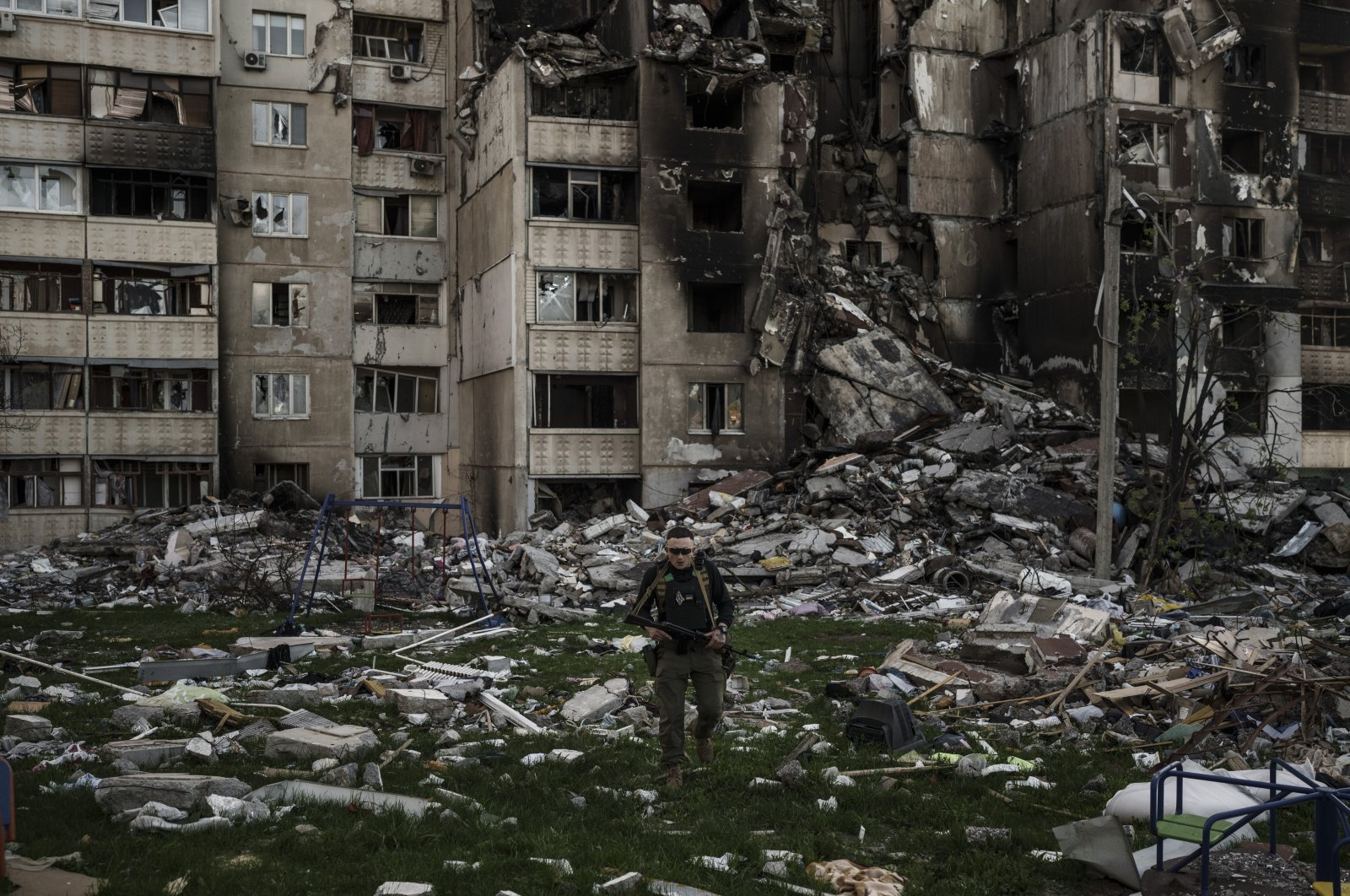 A Ukrainian serviceman walks amid the rubble of a building heavily damaged by multiple Russian bombardments near a frontline in Kharkiv, Ukraine, April 25, 2022. (AP Photo)