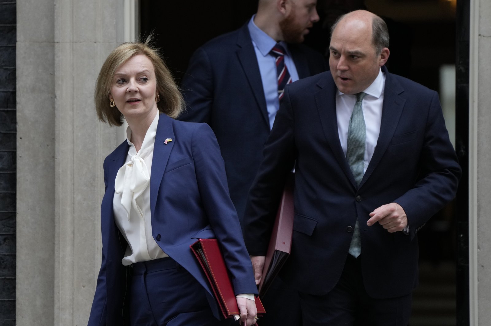 Britain&#039;s Foreign Secretary Liz Truss (L) and Britain&#039;s Defense Secretary Ben Wallace leave a Cabinet meeting at 10 Downing Street in London, April 19, 2022. (AP Photo)