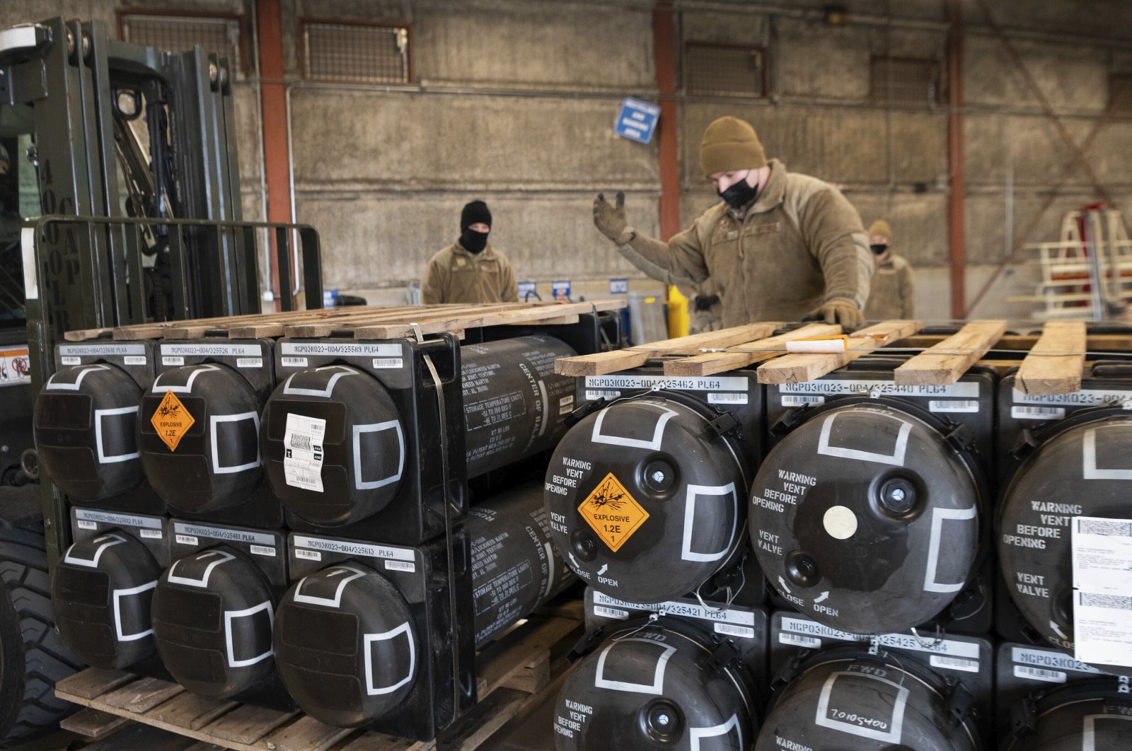 Airmen and civilians from the 436th Aerial Port Squadron palletize ammunition, weapons and other equipment bound for Ukraine during a foreign military sales mission at Dover Air Force Base, U.S., Jan. 21, 2022. (AP Photo)
