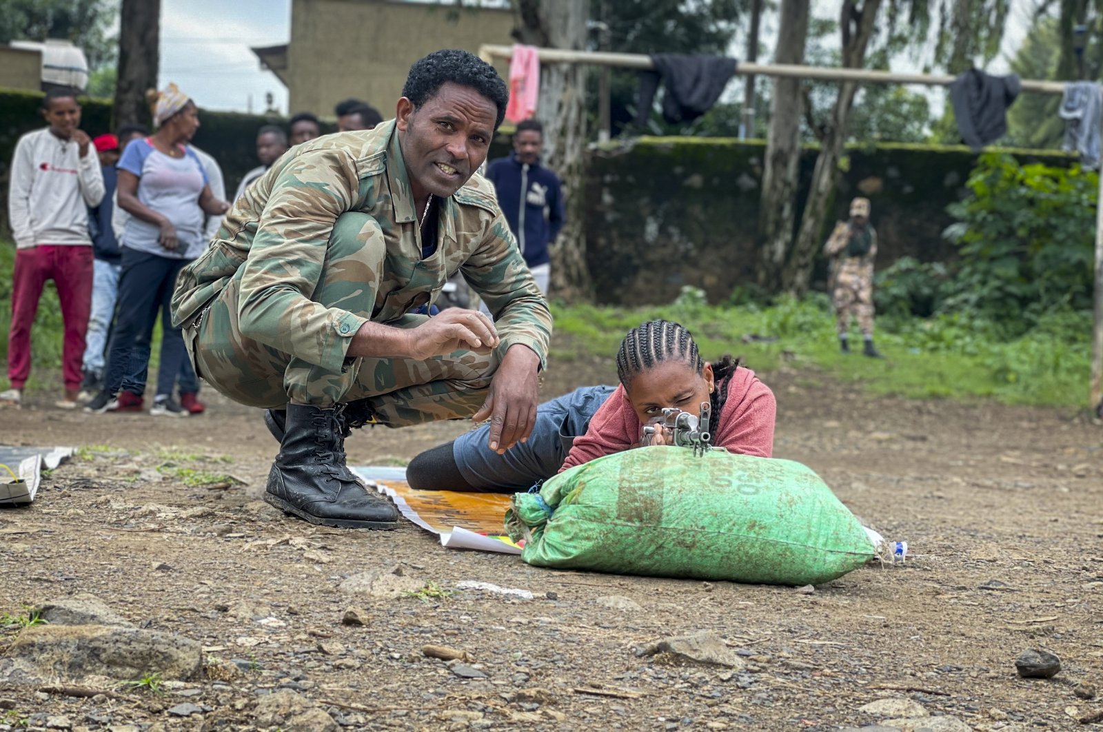 New volunteer Mekdess Muluneh Asayehegn (R) and others receive basic training to become potential reinforcements for pro-government militias or military forces, in a school courtyard in Gondar, in the Amhara region of northern Ethiopia, Aug. 24, 2021. (AP Photo)