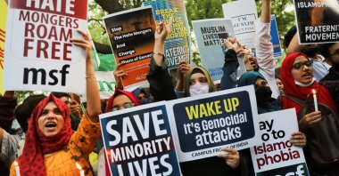 Citizens shout slogans and hold placards during a peace vigil organized by citizens against hate crimes and violence against Muslims, New Delhi, India, April 16, 2022. (Reuters Photo)