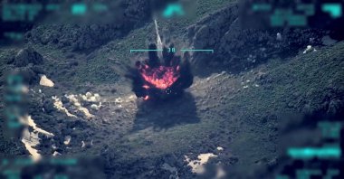 A view of a target being hit during a military operation is seen in this still image taken from a handout video recorded at an unknown location and released on April 18, 2022. (Reuters Photo)