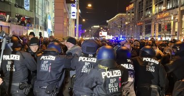 Protestors and police clash during a protest against COVID-19 measures in Magdeburg, Germany, Jan. 24, 2022. (AP Photo)