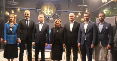 Turkish Vice President Fuat Oktay (3rd-L) with relatives of martyrs and veterans at an iftar program in Gaziantep, southeastern Turkey, April, 29, 2022. (IHA Photo)