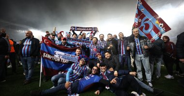 Trabzonspor fans celebrate their team's championship on the field at the Şenol Güneş Stadium in Trabzon, northern Turkey, April 30, 2022. (AA Photo)