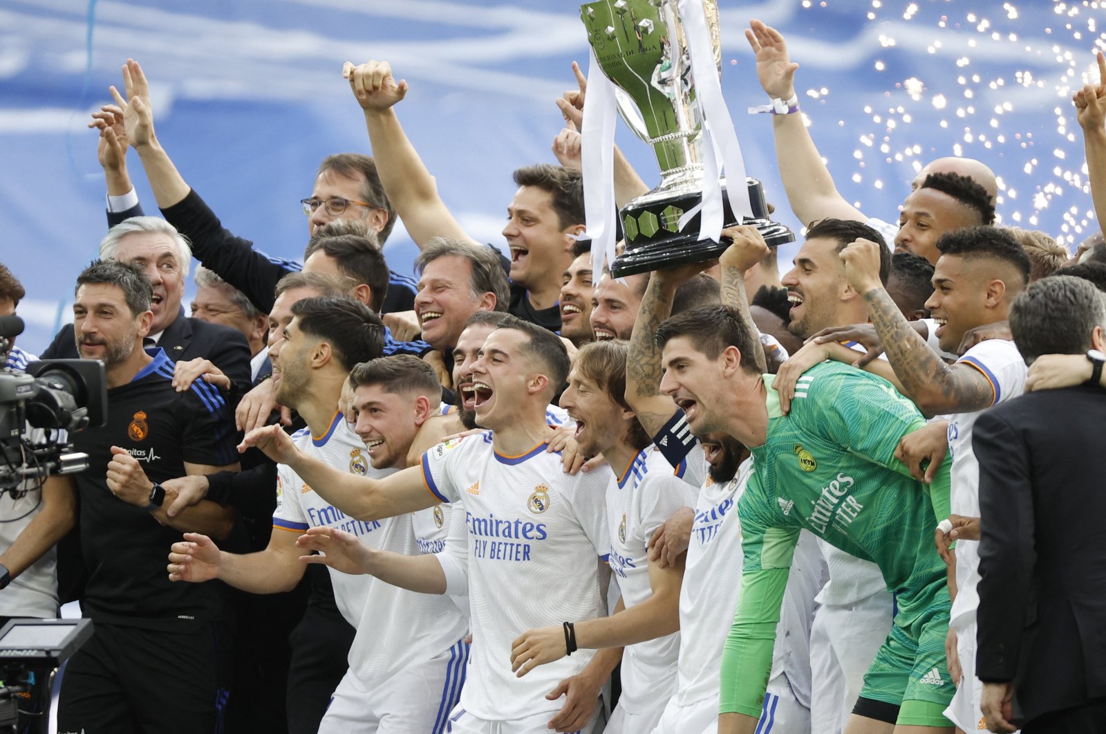 Real Madrid&#039;s Marcelo holds the trophy and celebrates with team members after winning the La Liga title at their home ground, Santiago Bernabeu Stadium in Madrid, Spain, April 30, 2022. (Reuters Photo)