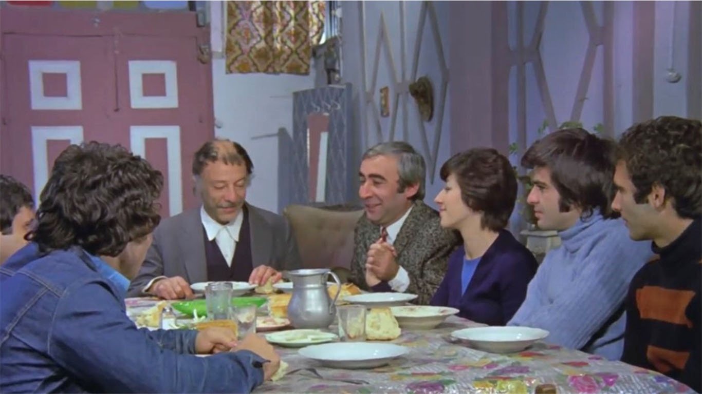 A still shot from &quot;Bizim Aile&quot; shows the main family of the film having a bayram dinner together.