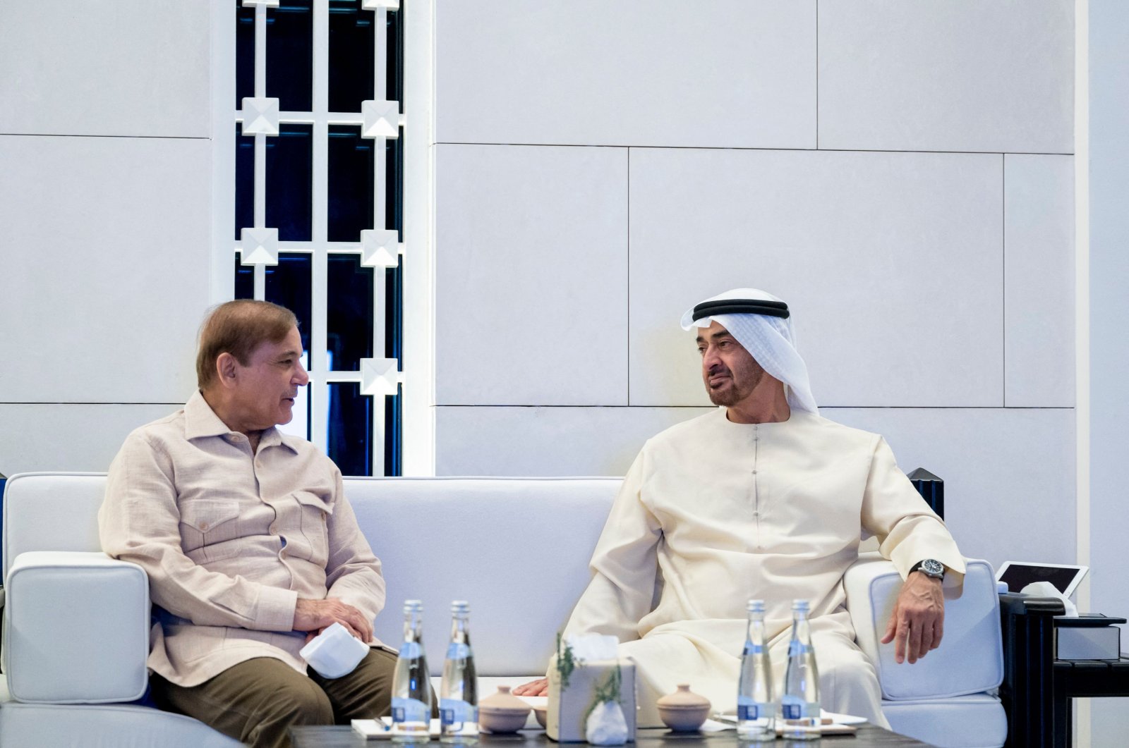 Pakistan Prime Minister Shahbaz Sharif (L) and Abu Dhabi Crown Prince Sheikh Mohammed bin Zayed Al Nahyan meet in Abu Dhabi, UAE, April 30, 2022. (UAE Ministry of Presidential Affairs Handout via AFP)