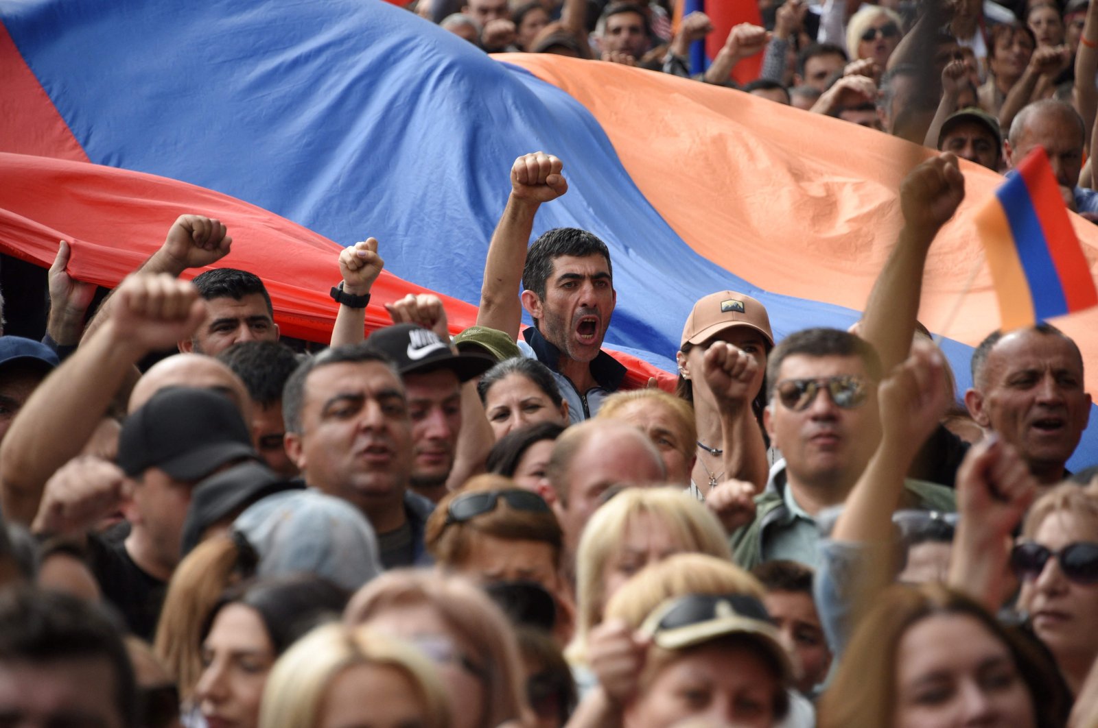 Demonstrators shout slogans as they attend an opposition rally in Yerevan on May 1, 2022, held to protest against Karabakh concessions. (AFP Photo)
