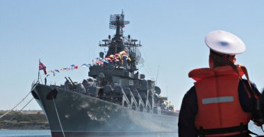 A sailor looks at the Russian missile cruiser Moskva moored in the Ukrainian Black Sea port of Sevastopol, Ukraine, 2013. (Reuters File Photo)