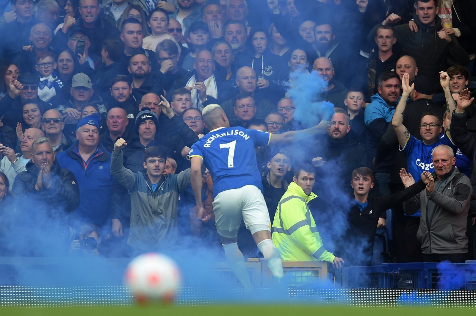 Everton&#039;s Richarlison runs with a lit flare after scoring the opening goal during the English Premier League match between Everton FC and Chelsea FC in Liverpool, Britain, May 1, 2022. (EPA)