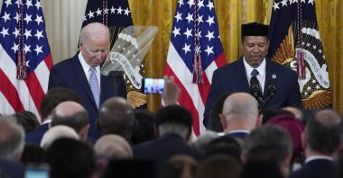 President Joe Biden (L) bows his head as Talib M. Shareef (R), president and imam of the historic Nation&#039;s Mosque Masjid Muhammad in Washington, gives a prayer during a reception to celebrate Ramadan Bayram in the East Room of the White House in Washington, U.S., May 2, 2022. (AP Photo)
