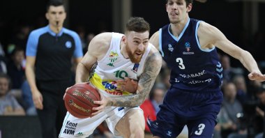 Bursaspor's Onuralp Bitim vies with MoraBanc Andorra's Oriol Pauli in a EuroCup match in Andorra, April 3, 2022. (IHA Photo)