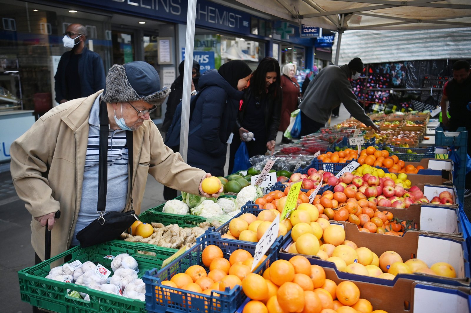 A man purchases fruit on a market stall in London, U.K., April 26, 2022. (EPA Photo)