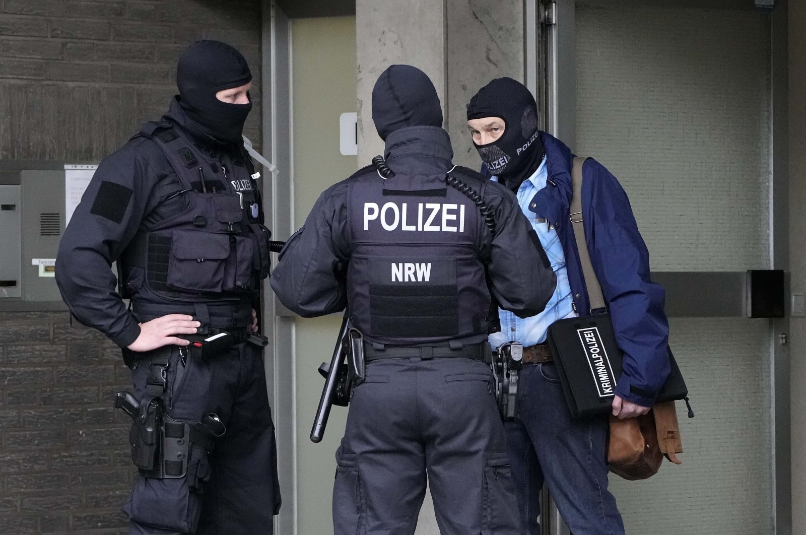 Police investigate in Duesseldorf, Germany, as part of raids in several German cities, Wednesday, Oct. 6, 2021. (AP File Photo)