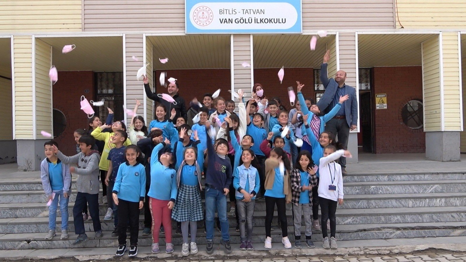 Students at a school throw COVID-19 masks into the air after the end of the mask mandate, in Bitlis, eastern Turkey, April 28, 2022. (IHA PHOTO)