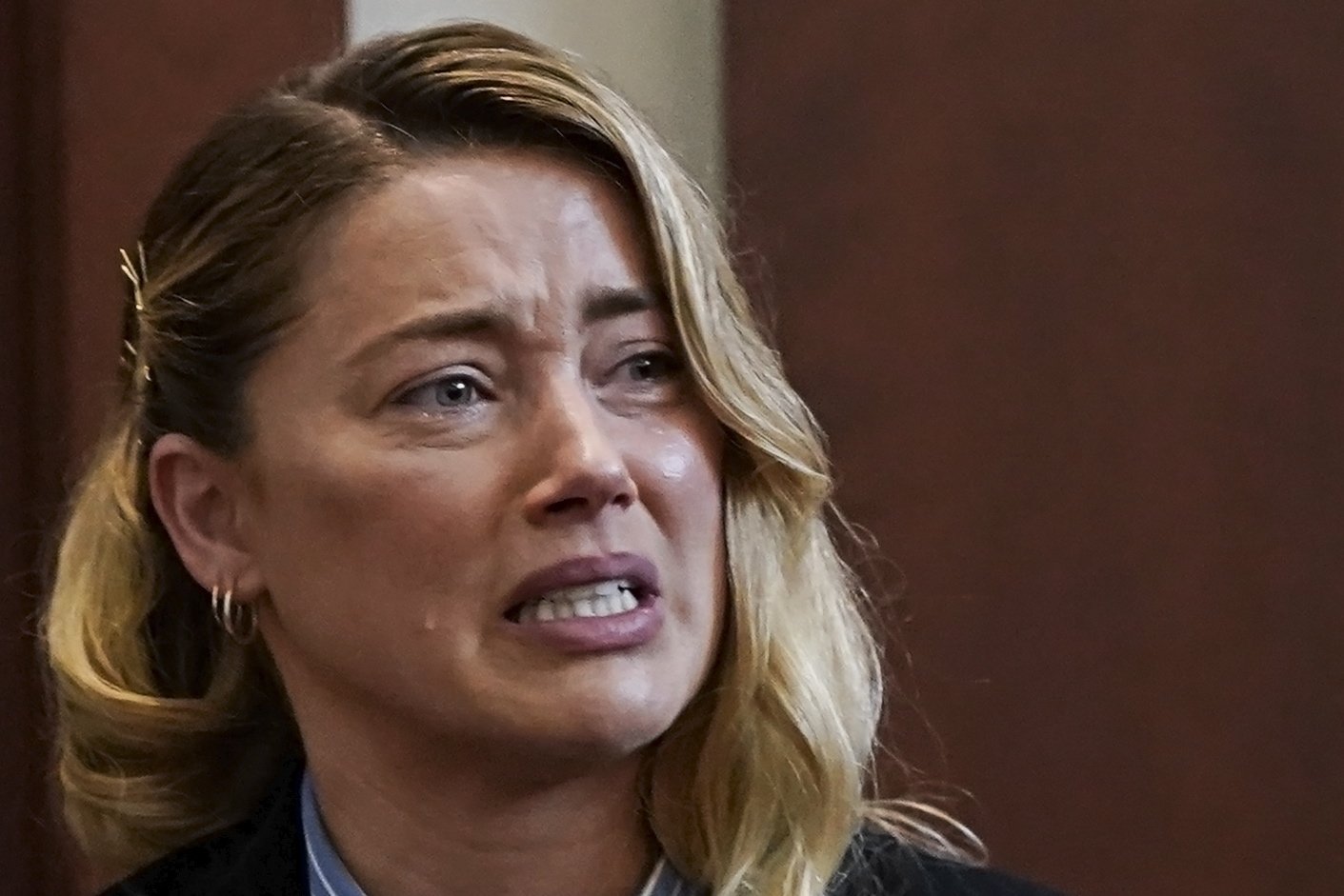 U.S. actress Amber Heard reacts as she testifies during the Depp vs. Heard defamation case at Fairfax County Circuit Court, in Fairfax, Virginia, U.S., May 4, 2022. (EPA Photo)