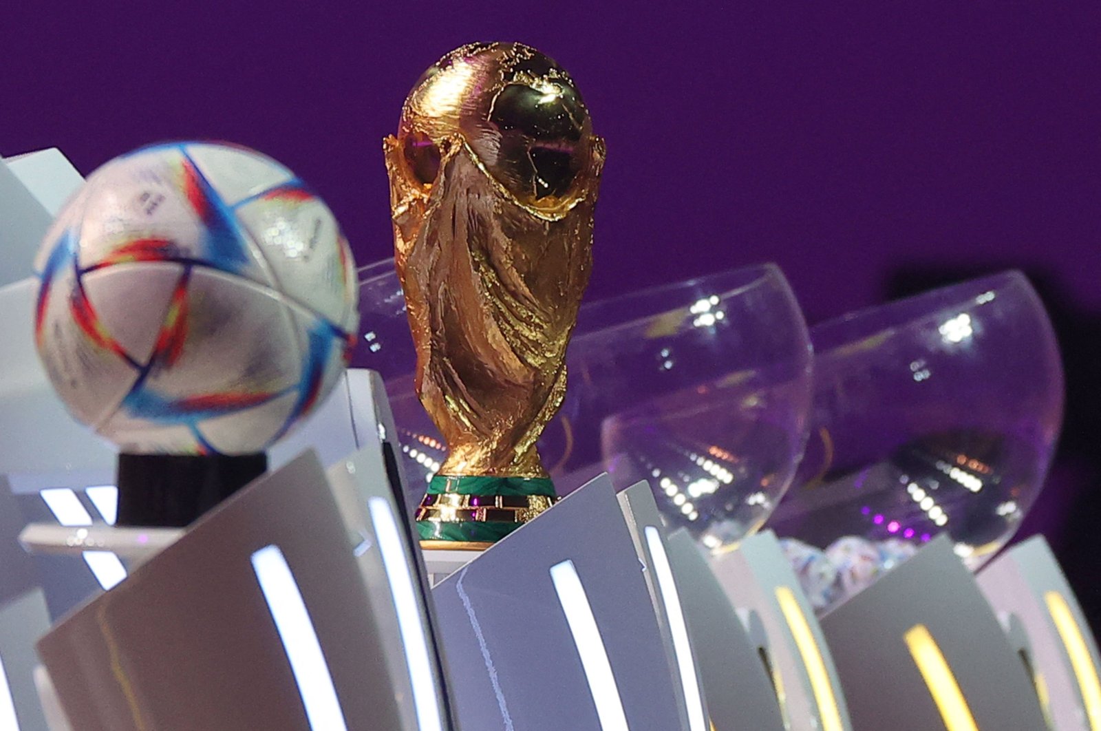 The FIFA World Cup trophy and the official 2022 World Cup ball is seen in Doha, Qatar, April 1, 2022 (AFP Photo)