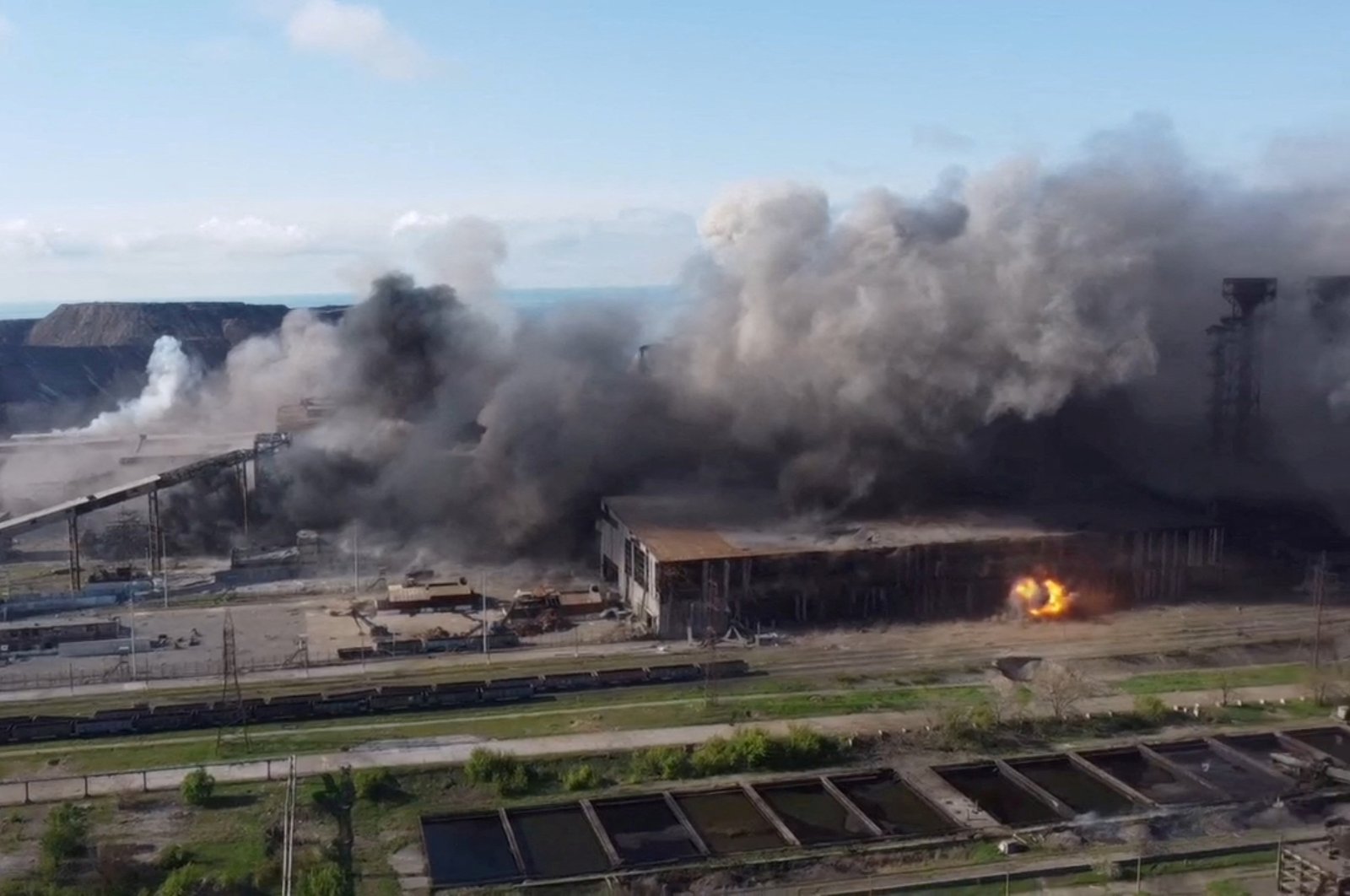 An aerial view shows shelling in the Azovstal steel plant complex, amid Russia&#039;s invasion of Ukraine, in Mariupol, Ukraine, in this screengrab taken from a handout video released on May 5, 2022. (Azov Regiment Handout via Reuters)