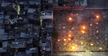 The mass cremation of people who died from complications related to COVID-19 is seen at a crematorium ground in New Delhi, India, April 22, 2021. (Reuters Photo)