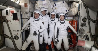 ESA astronaut Matthias Maurer (L) and NASA astronauts Tom Marshburn (C-L), Raja Chari (C-R) and Kayla Barron pose for a photo in their Dragon spacesuits, aboard the International Space Station&#039;s Harmony module, April 21, 2022. (NASA via AP)