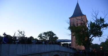 People gather on a bridge for throwing "wish papers" into the river, in Edirne, northwestern Turkey, May 6, 2022. (DHA Photo)