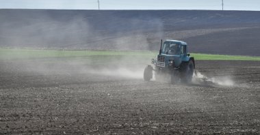 A farmer drives a tractor on a field in the Khmelnytsky region, Ukraine, May 2, 2022. (EPA Photo)