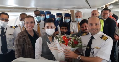 The cabin crew of Saudi Arabia's Saudia pose for a photo after landing at Istanbul Airport for the first time in two years due to a coronavirus hiatus, Istanbul, Turkey, May 7, 2022. (DHA Photo)