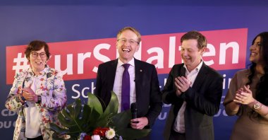 Daniel Gunther (CDU) Minister-President of Schleswig-Holstein and top candidate for his party, second left, stands on stage at the election party after the first forecasts for the state election in Schleswig-Holstein were announced, In Kiel, Germany, Sunday, May 8, 2022. (Christian Charisius/dpa via AP)