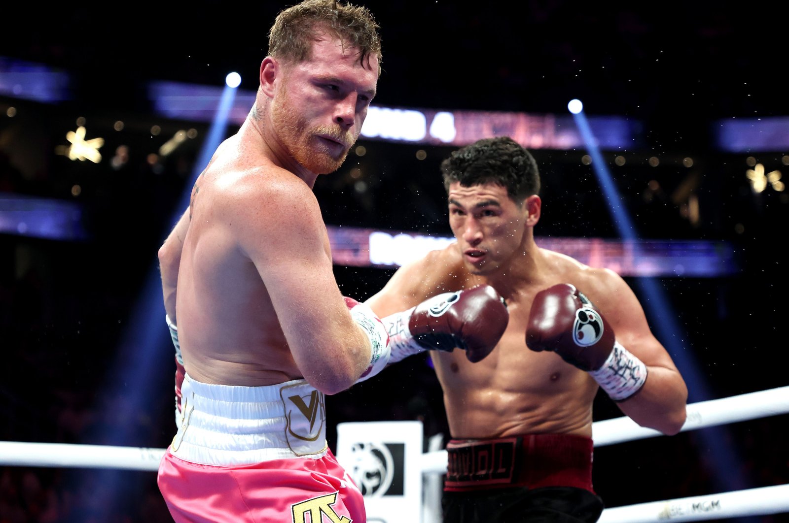 Dmitry Bivol (R) punches Canelo Alvarez during their WBA light heavyweight title fight, Las Vegas, U.S., May 07, 2022. (AFP Photo)