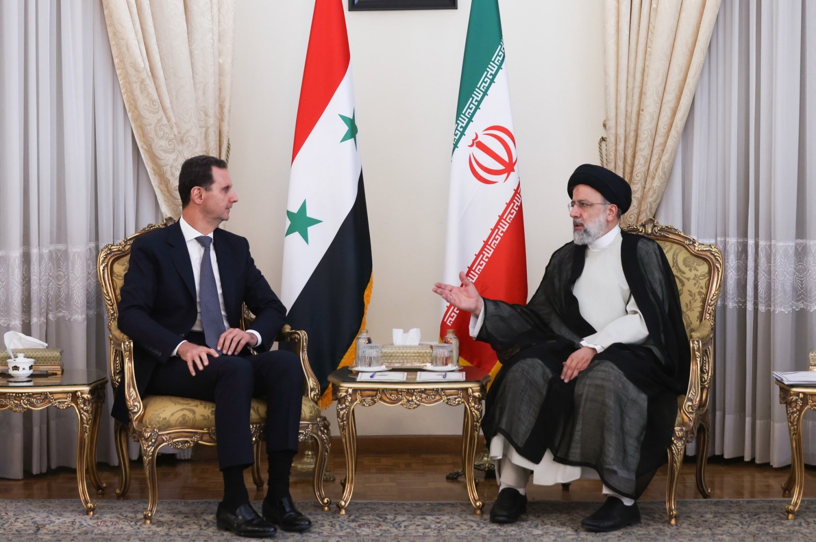 Iranian President Ebrahim Raisi (R) meeting with his Syrian counterpart Bashar Assad (L), in Tehran, Iran, 08 May 2022. (EPA)