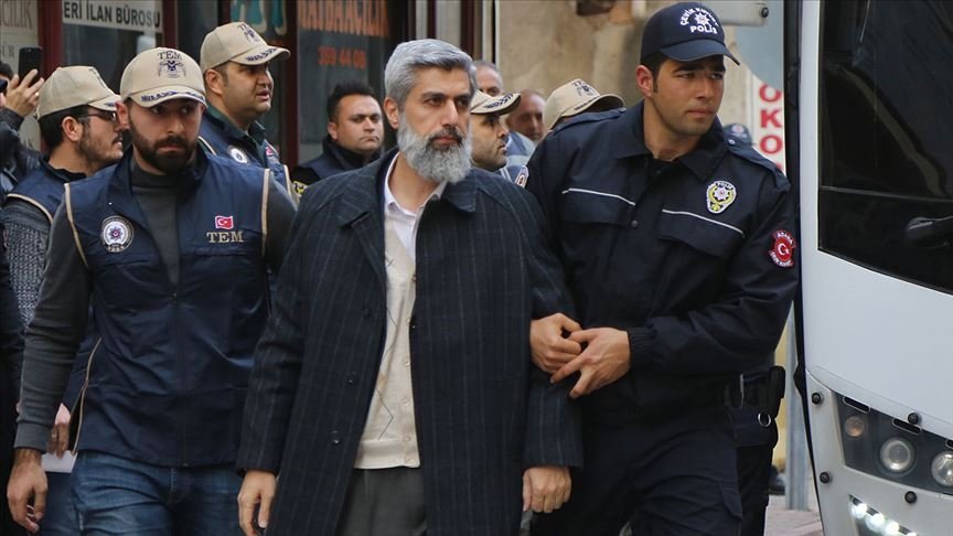 Police escort Alparslan Kuytul after his arrest, in Adana, southern Turkey, Feb. 8, 2018. (AA PHOTO) 