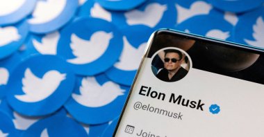 Elon Musk's Twitter profile is seen on a smartphone placed on printed Twitter logos in this picture illustration taken on April 28, 2022. (Reuters File Photo)