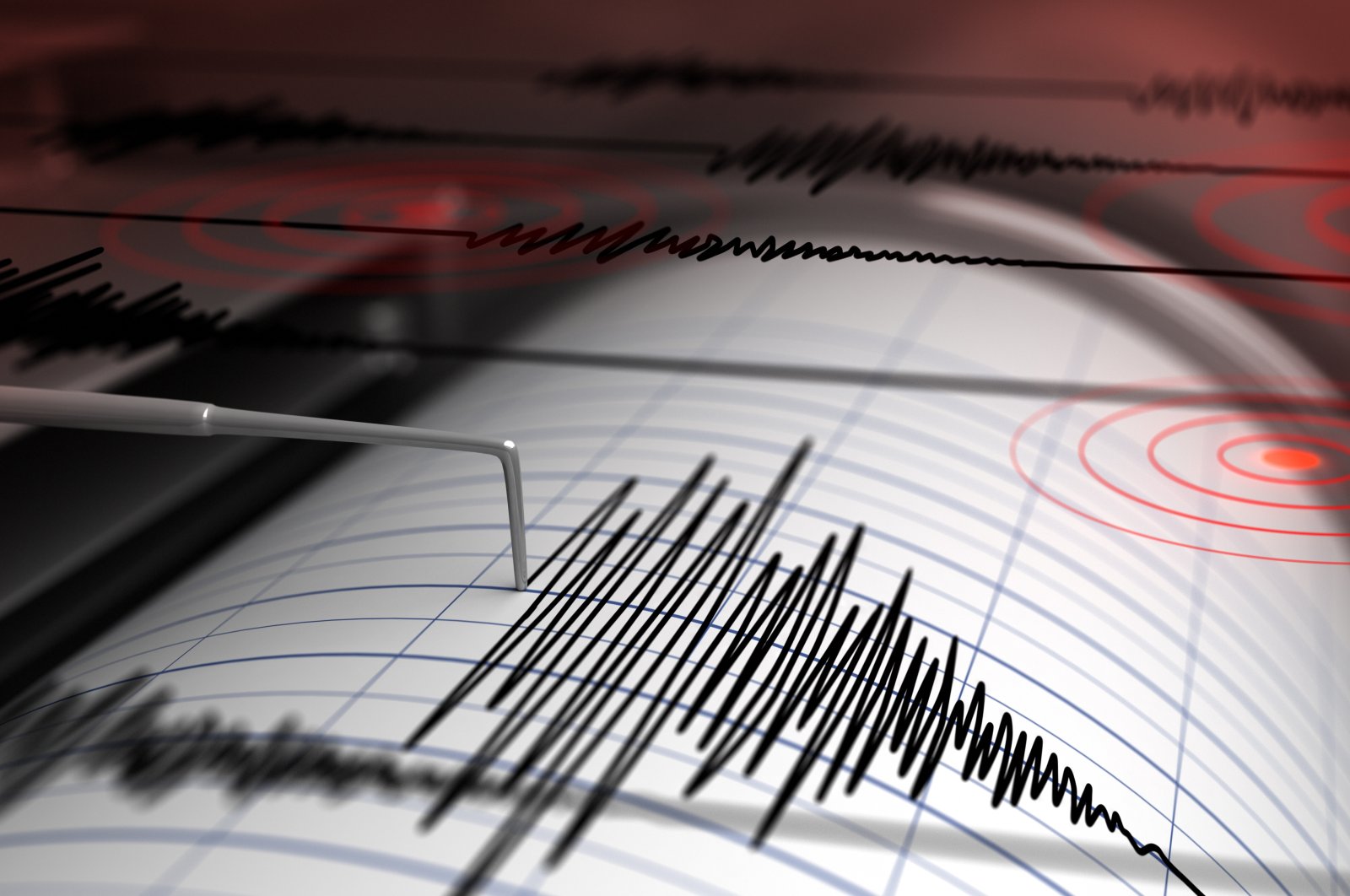 Seismograph with paper in action and earthquake (Shutterstock File Photo)