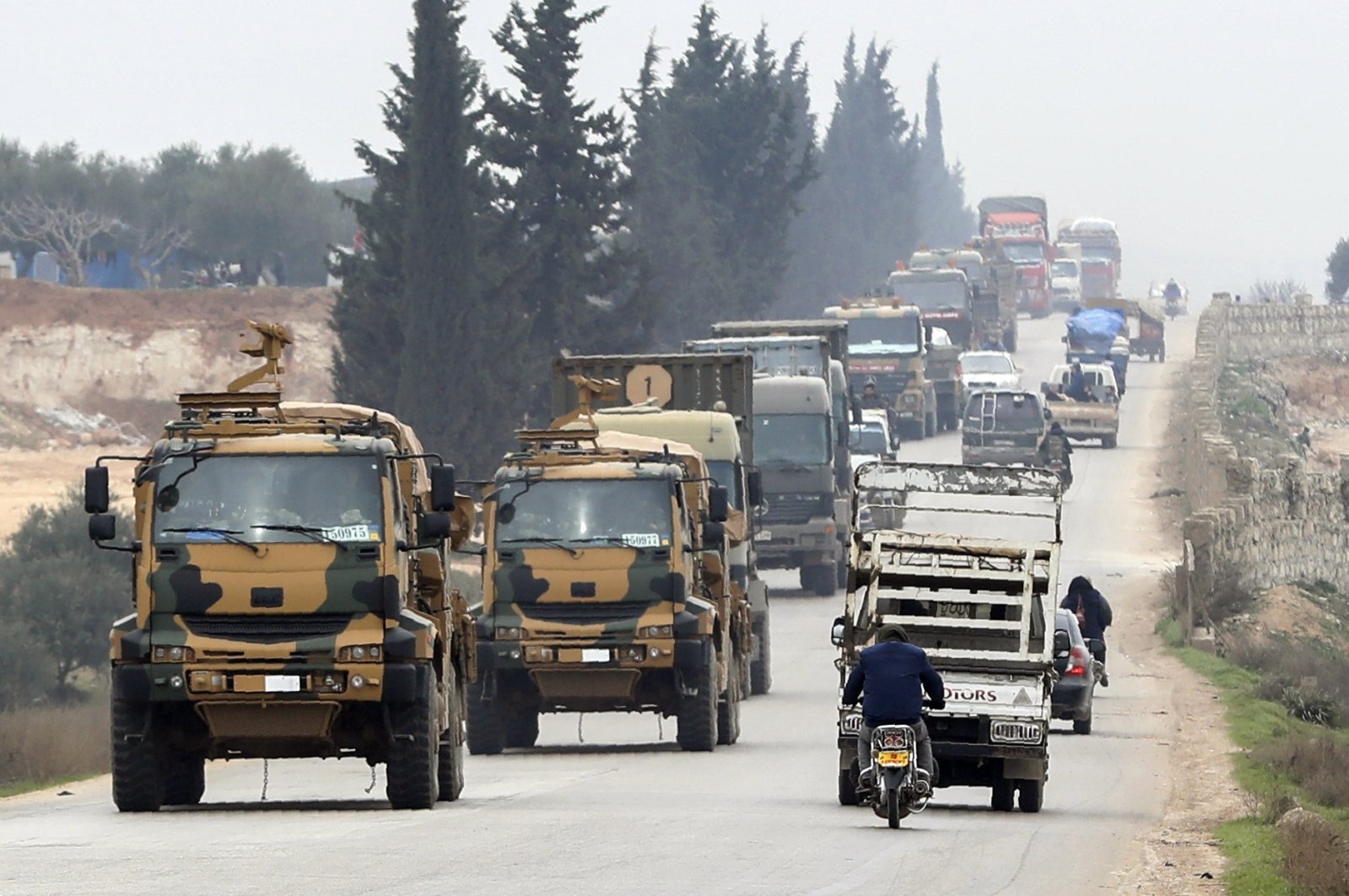 A Turkish military convoy moves in the east of Idlib, Syria, Feb. 28, 2020. (AP File Photo)