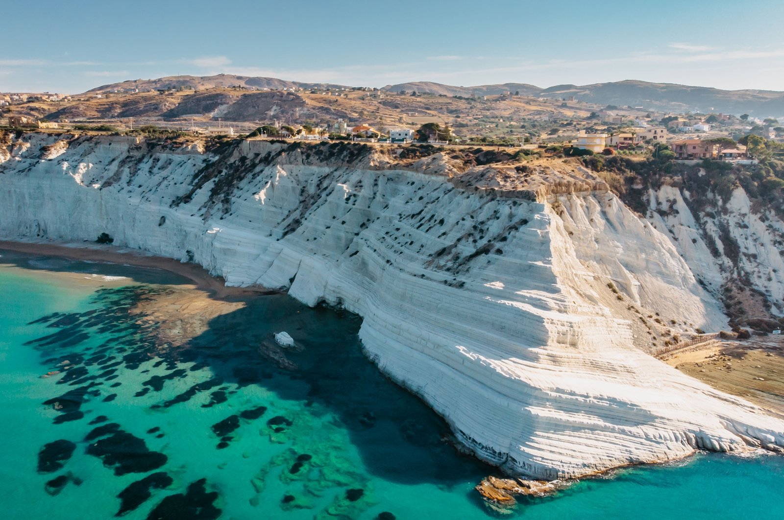 The white rocky cliffs of Scala dei Turchi is a must see of Sicilian seaside tourism. (Shutterstock Photo)