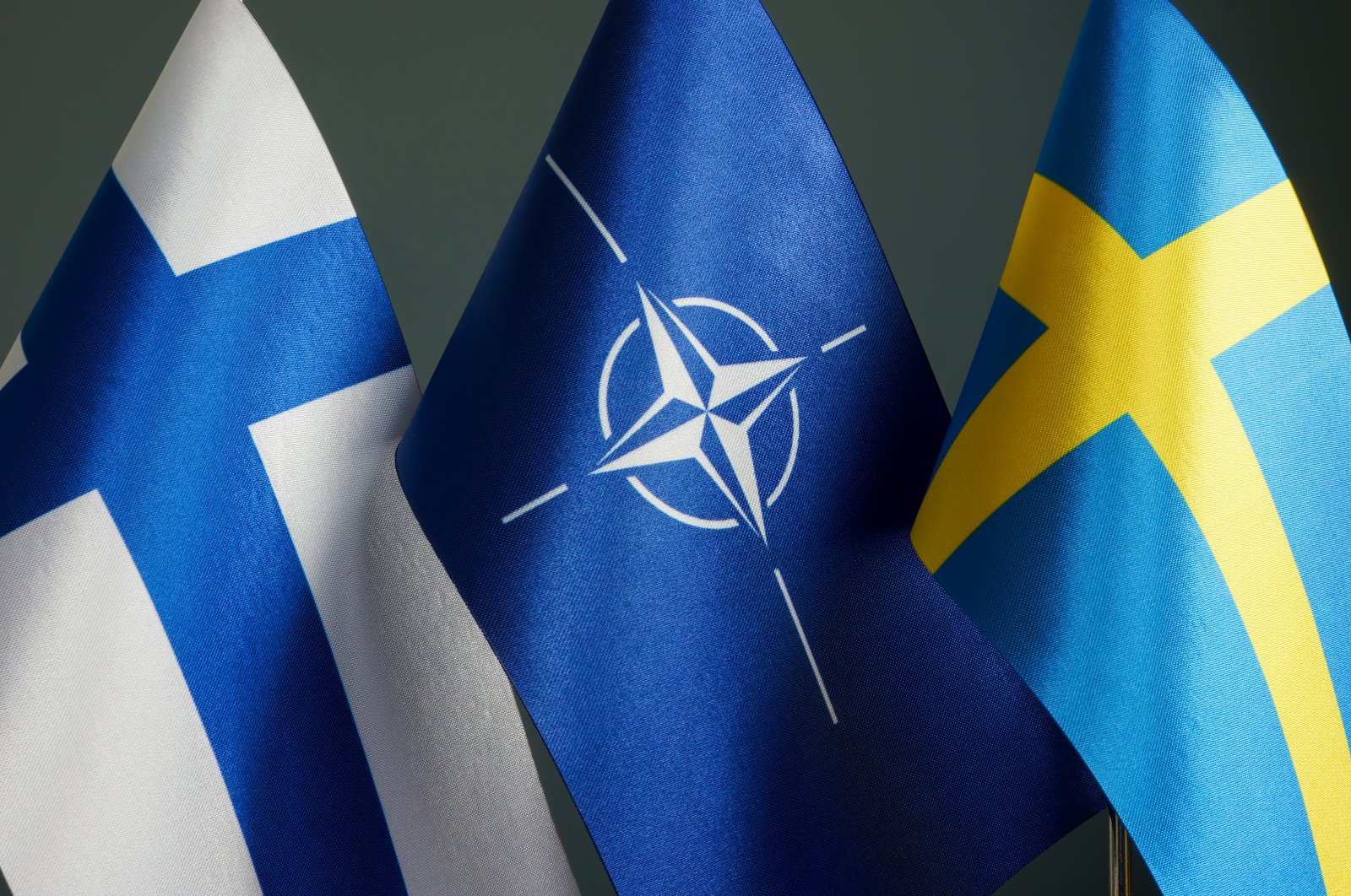The flags of Finland, NATO and Sweden. (Photo by Shutterstock)