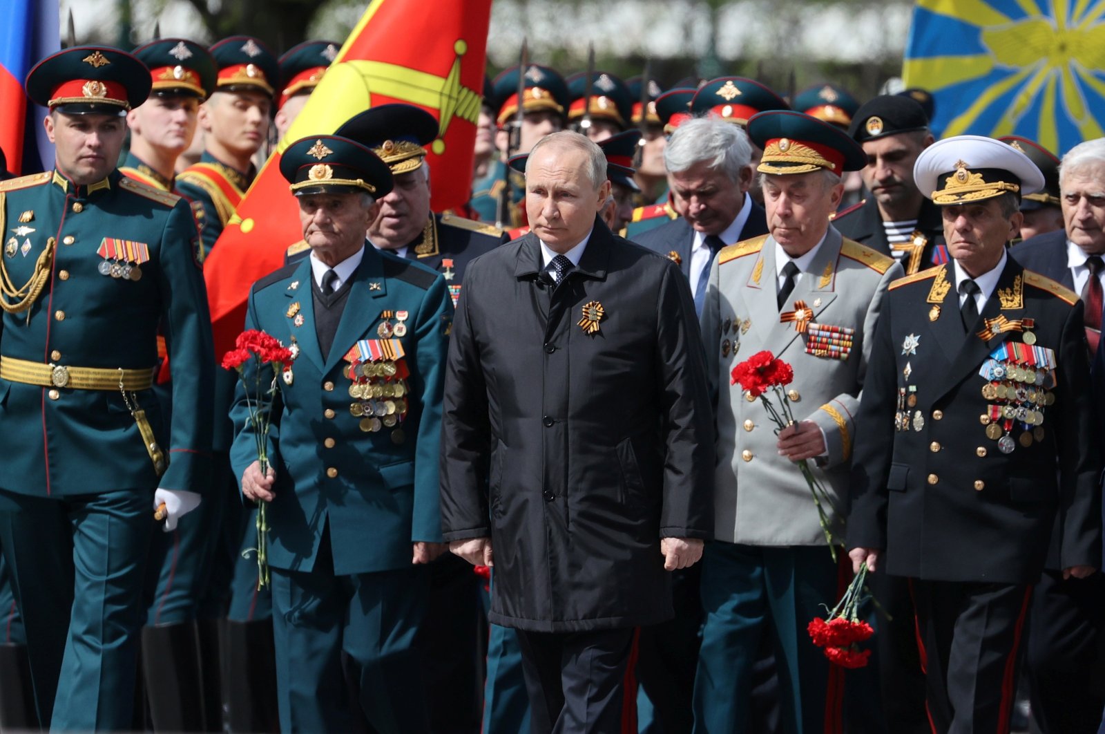 Russian President Vladimir Putin (C) attends a wreath-laying ceremony at the Tomb of the Unknown Soldier after the military parade marking the 77th anniversary of the end of World War II, in Moscow, Russia, Monday, May 9, 2022. (AP Photo)