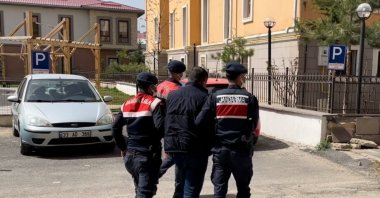 Gendarmerie officers escort a captured FETÖ suspect in Kahramanmaraş, southern Turkey, April 27, 2022. (AA PHOTO)