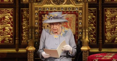 Queen Elizabeth II reads the Queen's speech on her throne in the House of Lords during the opening of Parliament at the Houses of Parliament, London, U.K., May 11, 2021. (AFP Photo)