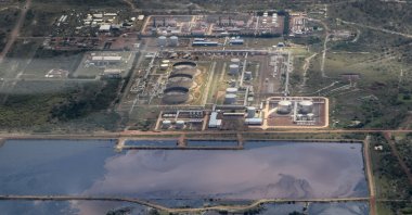 A reservoir of polluted water lies next to an oil field, seen from the air, in Paloch, South Sudan, Sept. 27, 2018. (AP Photo)